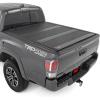 imageRough Country Hard TriFold Tonneau Cover for Toyota Tacoma 20162023  LowProfile Aluminum Truck Bed Cover Fits 5 Bed 605quot5 Bed
