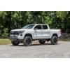 imageRough Country 4quot Lift Kit with M1 StrutsM1 Monotube Shocks for Chevy Colorado ampamp GMC Canyon 20232026