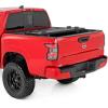 imageRough Country Hard TriFold Tonneau Cover for Nissan Frontier 20222026  LowProfile Aluminum Truck Bed Cover Fits 5 Bed 589595quot wUtiliTrack Cargo MGMT