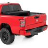 imageRough Country Hard TriFold Tonneau Cover for Nissan Frontier 20222026  LowProfile Aluminum Truck Bed Cover Fits 5 Bed 589595quot wUtiliTrack Cargo MGMT