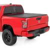 imageRough Country Hard TriFold Tonneau Cover for Nissan Frontier 20222026  LowProfile Aluminum Truck Bed Cover Fits 5 Bed 589595quot wUtiliTrack Cargo MGMT